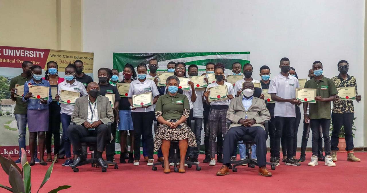 seated (far left) mr. samuel gitau, kippra board member; dr. rose ngugi, executive director, kippra; and prof. john ochola, dvc academic & research, kabarak university; with students who received certificates